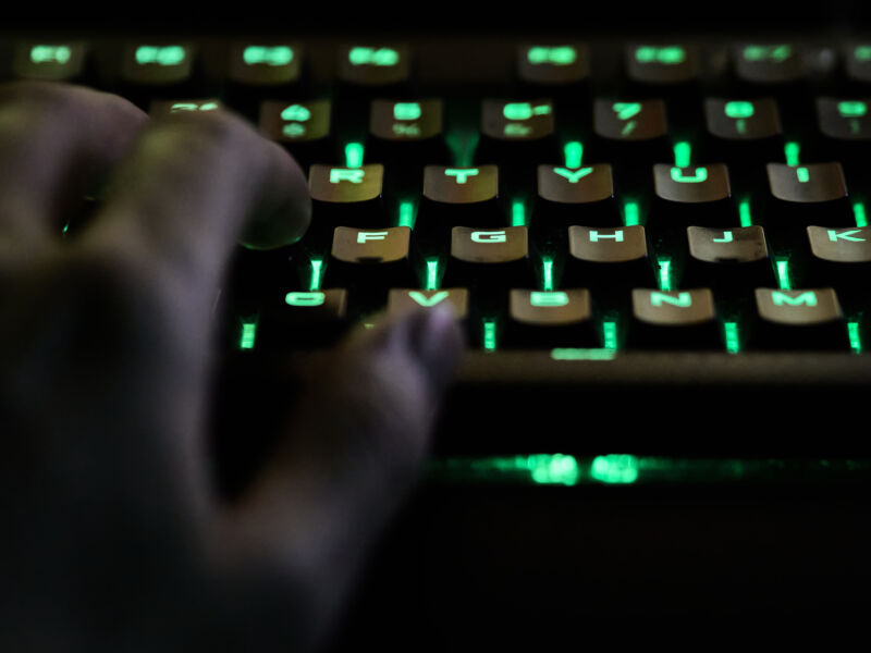 Man's hand with RGB keyboard during live streaming